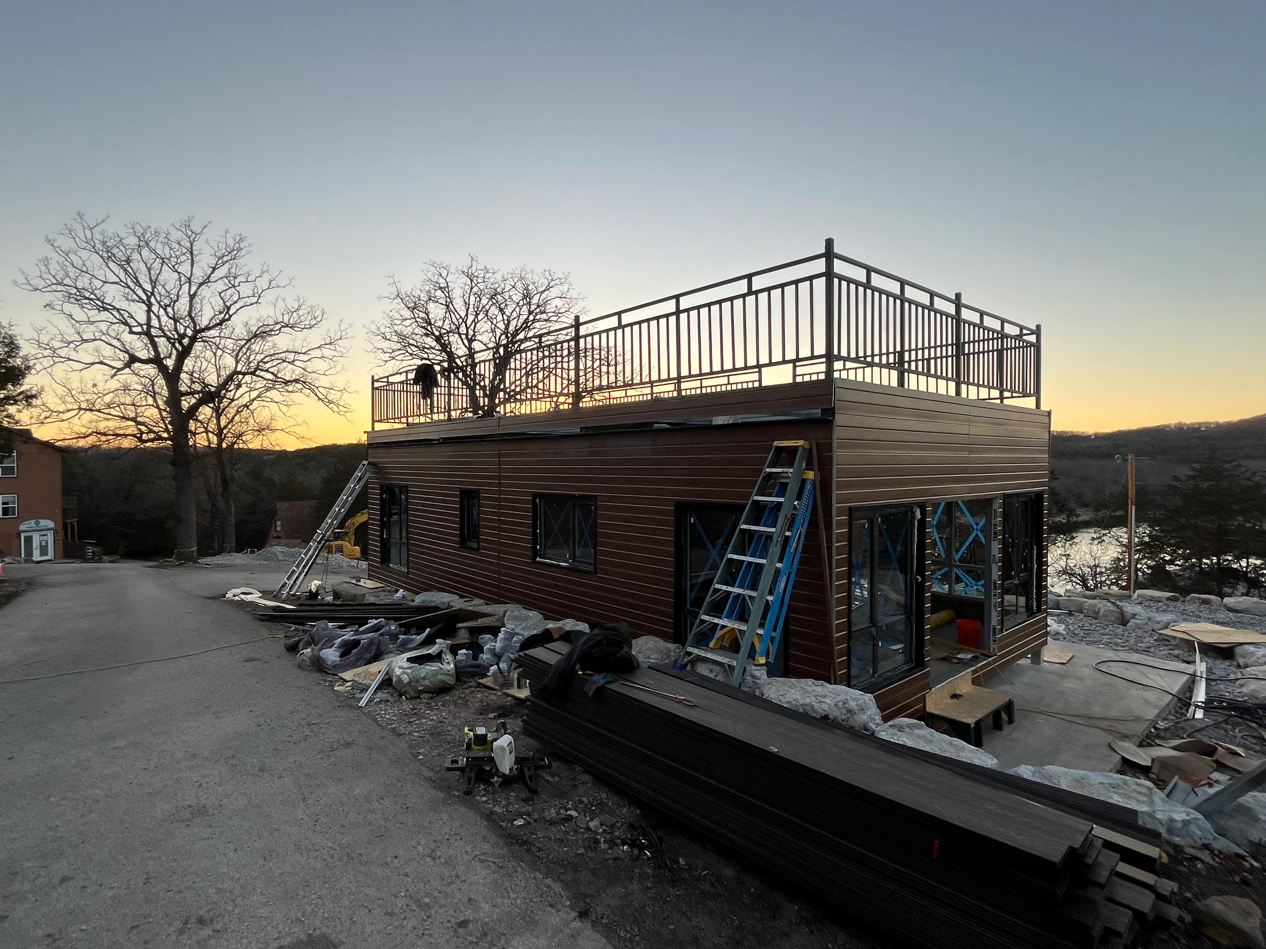 Prefabricated modular structure under field assembly at sunset