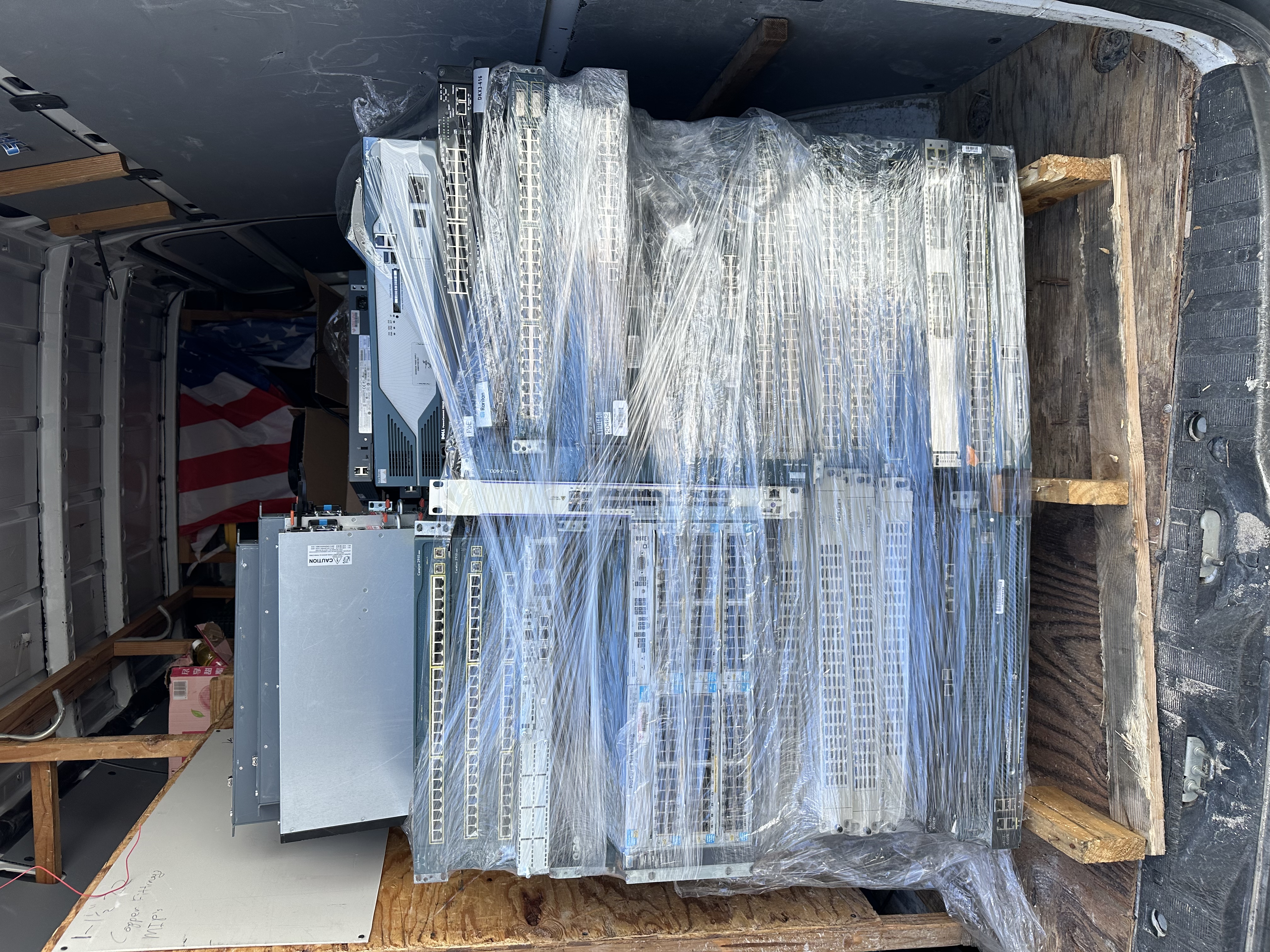 Wrapped network hardware loaded inside a transport vehicle